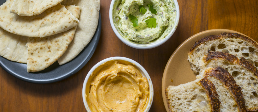 two plates of bread with two different types of butter